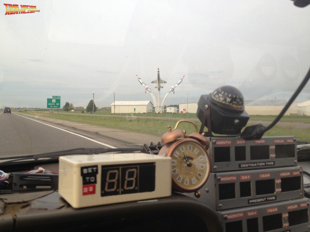 The Back to the Future Car Rental traveling south down I-35 past local Minnesota landmarks.