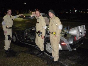 Casual Ghostbusters posing by the temporal displacement vehicle.